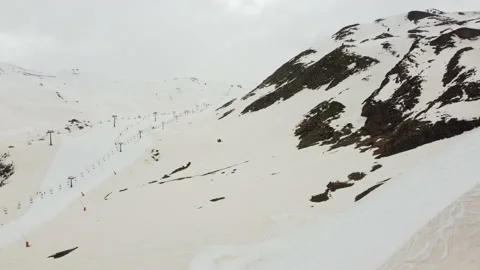 Panoramic view of a closed ski resort, with the slopes affected by the haze Stock Footage 172734671