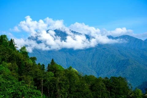Panoramic view of cloud covered picks of  Kanchenjunga mountain range in Sik Stock Photos
