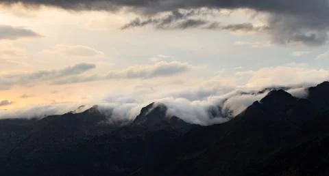 Panoramic View of Clouds Surrounding the Mountains Stock Photos
