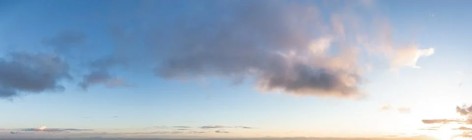Panoramic View of Cloudscape during a colorful sunset or sunrise. Stock-Fotos