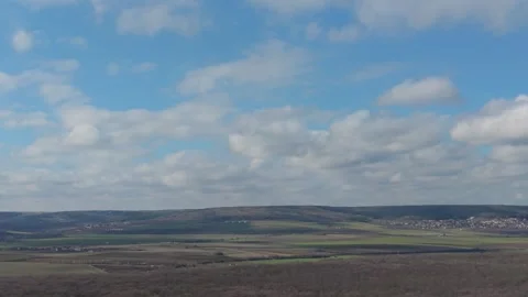 Panoramic view of cloudy sky above distant landscape Stock Footage 328571792