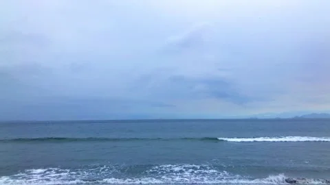 Panoramic view of cloudy sky and sea waves Stock Footage 232293425