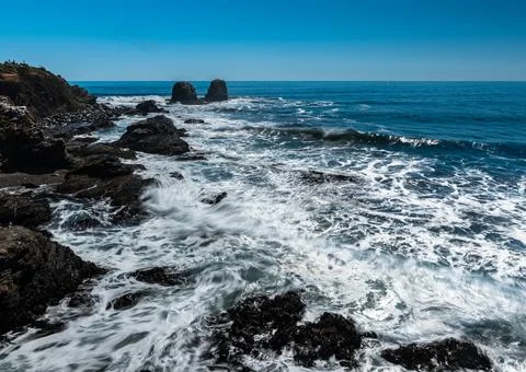 Panoramic view of the coast of punta de lobos on a sunny day. Stock Photos