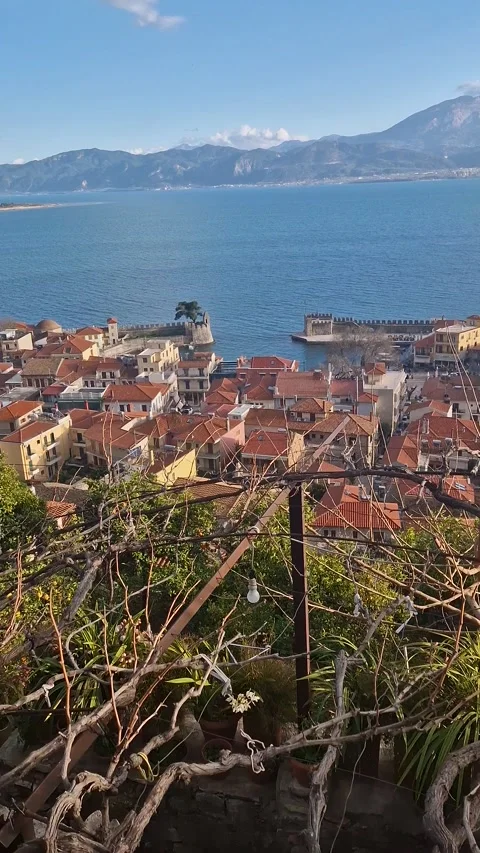 Panoramic View of Coastal Town with Medieval Castle and Red Roofs by the Sea – U Stock Footage 317994841