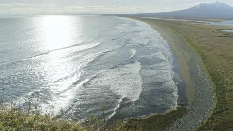 Panoramic view of the coastline of the Pacific Ocean against volcanoes Stock Footage 168220794