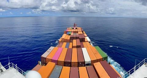 Panoramic View from Compass Deck Over Colorful Container Ship Sailing Across Cal Stock Photos