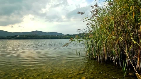 Panoramic view of Corgeno lake from the beach Stock Footage 284377478