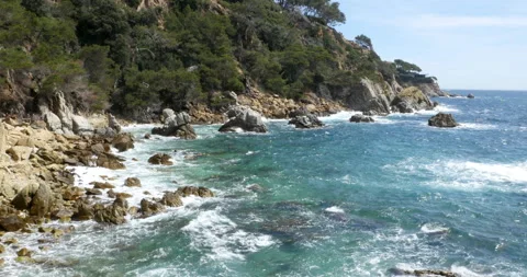 Panoramic View of Costa Brava – Dynamic Mediterranean Coastline 動画素材 299411533