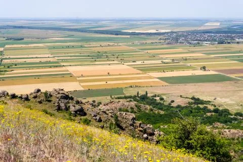 Panoramic view of crop fields in Greci village, near Macin mountains Stock Photos