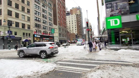 Panoramic view of crossroad in NYC after snow fall, snowy road, office buildings Stock Footage 170400314