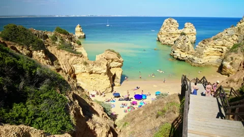 Panoramic view of a crowd of people on the beach in Lagos, Algarve Portugal. Stock Footage 169660535