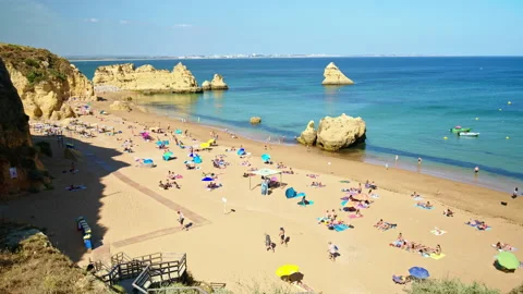 Panoramic view of a crowd of people on the beach in Lagos, Algarve Portugal. Stock Footage 169660604