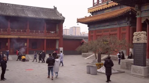A panoramic view of a day at the temple, people are praying, walking the temple Stock Footage 125275975