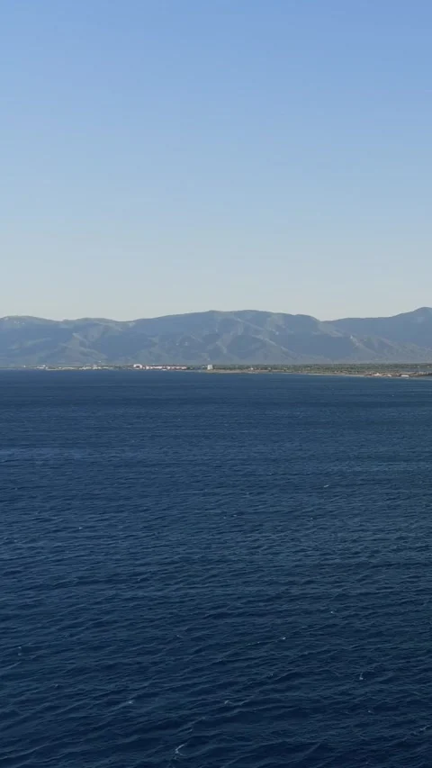 A panoramic view of the deep blue Mediterranean Sea with gentle waves in the Stock Footage 346663211