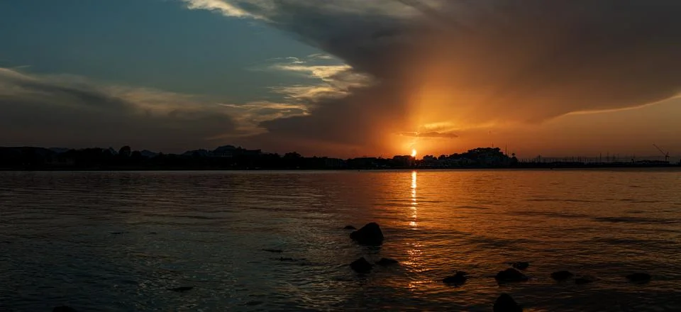 Panoramic view of a deep partial solar eclipse over Denia Spain showing gol.. Foto stock