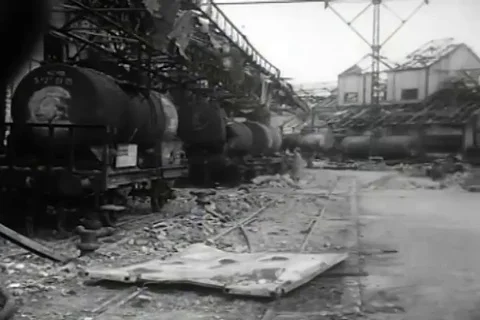 Panoramic view of destroyed railroad tank cars and other facilities - 1944 Stock Footage 112177340