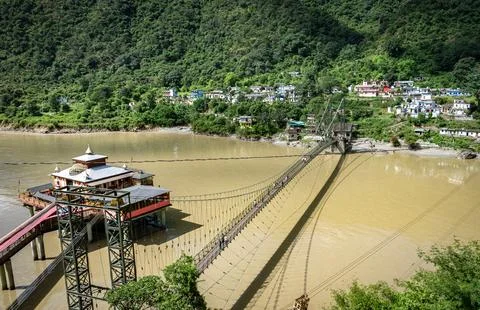 Panoramic View of the Dhari Devi Temple, Suspension Bridge, and Alaknanda River  Stock Photos