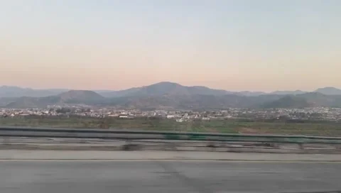 Panoramic view of distant mountains and cityscape Stock Footage 333613380