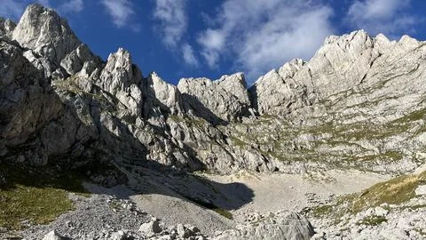 Panoramic view of the Dolomites mountain peaks. Massive sharp and high stone Stock Photos