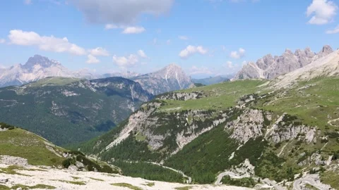 Panoramic View of Dolomites Mountain Range and Verdant Valleys, Italy Stock Footage 334287164