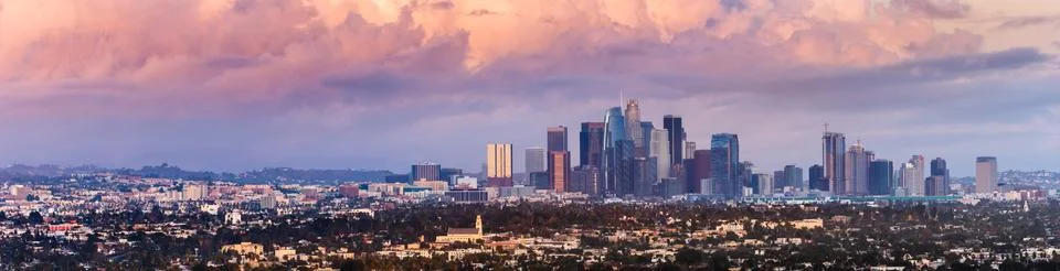 Panoramic view of downtown Los Angeles skyline at sunset, colorful storm cove Stock Photos