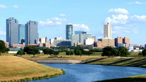 Panoramic View of Downtown Skyline with River and Green Space Stock Footage 311394514