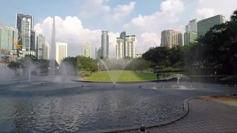Panoramic view of downtown skyscrapers, Symphony lake fountain, Kuala Lumpur Stock Footage 165210345