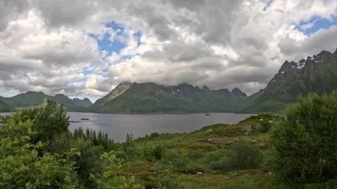 Panoramic view of dramatic fjord surrounded by sharp mountain peaks in Norway 動画素材 343833614