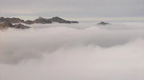 Panoramic view of dramatic mountain scenery, rocky peaks piercing the clouds Stock Footage 39494659