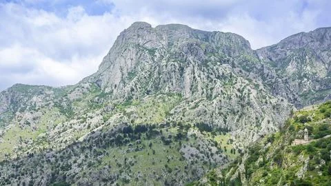 Panoramic view of dramatic mountains above coastal town in Kotor, Montenegro. Stock-Fotos