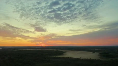 Panoramic view from a drone around bright orange dawn over the Northern regions 스톡 동영상 134946937