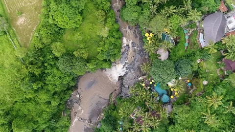 Panoramic view from drone, brown river in jungle, there is spa hotel Stock Footage 105669984