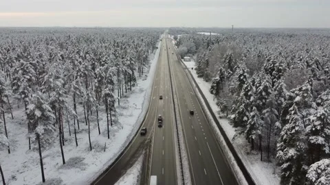 Panoramic view from a drone on the cars driving on the winter road Stock Footage 147031270