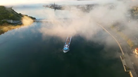 A panoramic view from a drone of a passenger ship flowing on the Rhone River Stock Footage 219589343