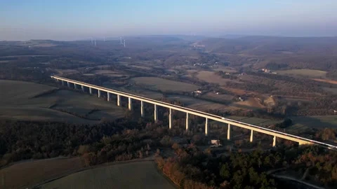 Panoramic view from a drone on passenger train crossing the railway flyover. Stock-Footage 233198084