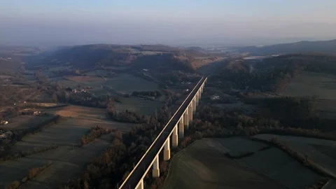 Panoramic view from a drone on passenger train crossing the railway flyover. Video stock 233263783