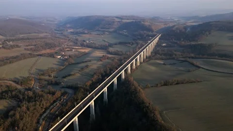 Panoramic view from a drone on passenger train crossing the railway flyover. Vidéo 233264044