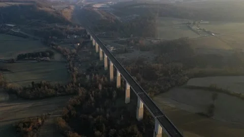 Panoramic view from a drone on passenger train crossing the railway flyover. Stock-Footage 233264112