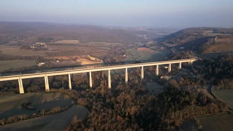 Panoramic view from a drone on passenger train crossing the railway flyover. Stock-Footage 233264257