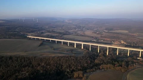 Panoramic view from a drone on passenger train crossing the railway flyover. Stock-Footage 233264395