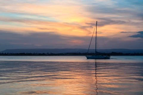 Panoramic view during sunset on the harbor of Ortigia island in the city Sy.. Stock Photos