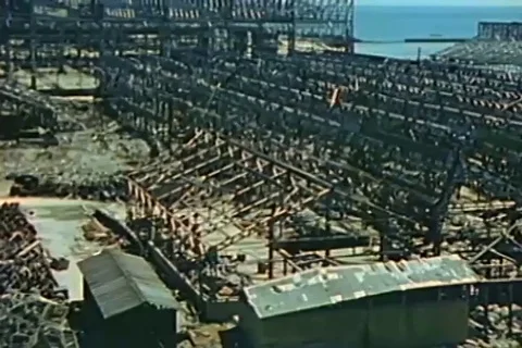 Panoramic view of the effect of blast to metal sides and roof - 1946 Stock Footage 103359874