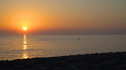 Panoramic view of the empty beach and the sea at sunrise Stock Footage 111875985