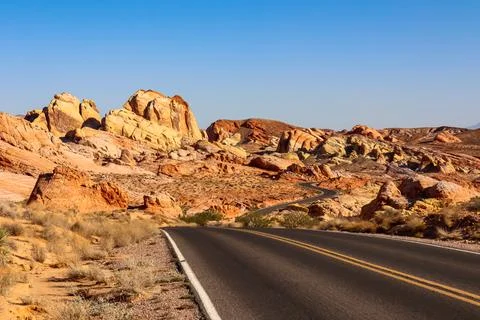 Panoramic view of endless winding empty road in Valley of Fire State Park l.. Stock Photos