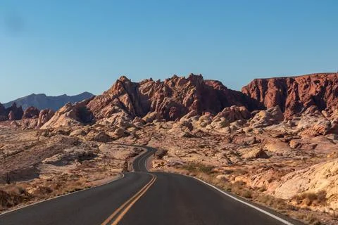 Panoramic view of endless winding empty road in Valley of Fire State Park l.. Stock Photos