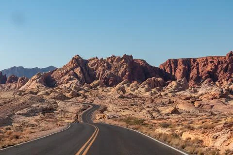 Panoramic view of endless winding empty road in Valley of Fire State Park l.. Stock Photos