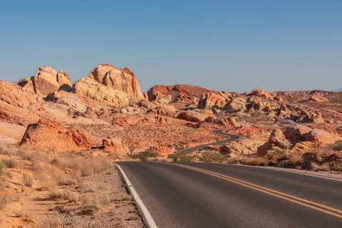 Panoramic view of endless winding empty road in Valley of Fire State Park l.. Stock Photos