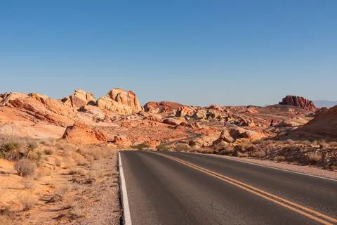 Panoramic view of endless winding empty road in Valley of Fire State Park l.. Stock Photos