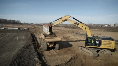 Panoramic View Of Excavator Digging Up Dirt And Emptying It Into Dump Truck Stock Footage 145378295