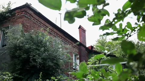 Panoramic view of an exterior of a two-storeyed residential house from brick. HD Stock-Footage 68523048